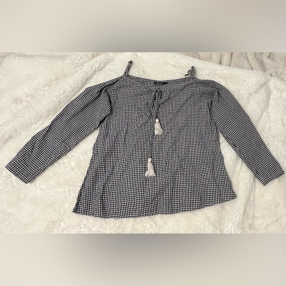Cute checkered shirt with cute white drawings, and size XS.